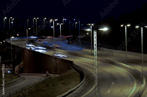traffic on highway at night photo