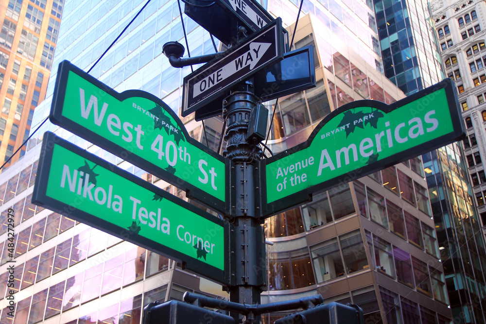 Green West 40th Street and Avenue of the Americas 6th ( Nikola Tesla corner ) Bryant Park traditional sign in Midtown Manhattan in New York City