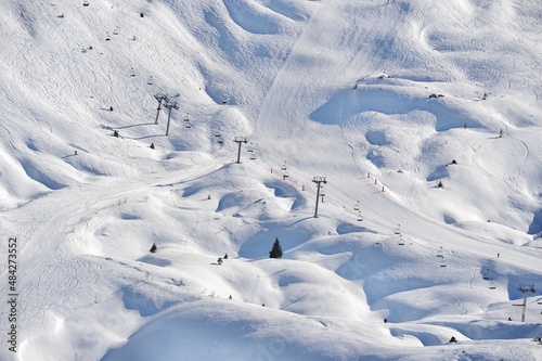 Ski slopes in winter covered with snow on French alps