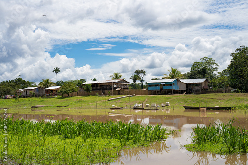 To the indigenous community of Gamboa next to the amazon river, Peru. typical architecture of the amazon. photo