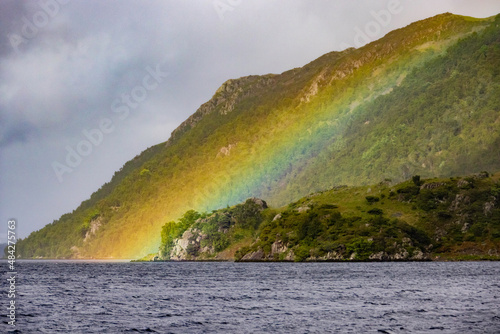 rainbow with a mountain in the background