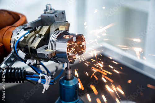 Obraz na płótnie production of car parts - robotization - automotive industry 4.0 or 5.0 w salonie