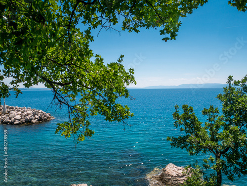 Sea, beach and green trees in Kostrena, Croatia