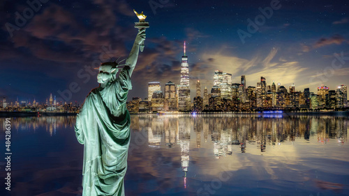 Statue of Liberty overlooking Manhattan photo