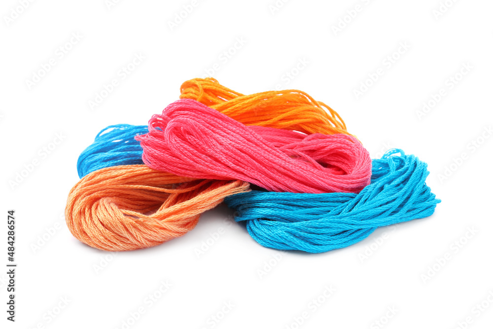 Different colorful embroidery threads on white background Different colorful embroidery threads on white background