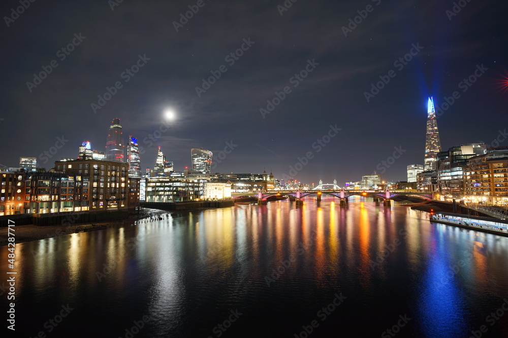 Night time reflections on the Thames