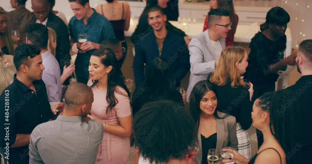 One party, lots of interesting personalities. Diverse group young people having drinks and socialising at a party. Social crowd standing and chatting during the night at a club or restaurant