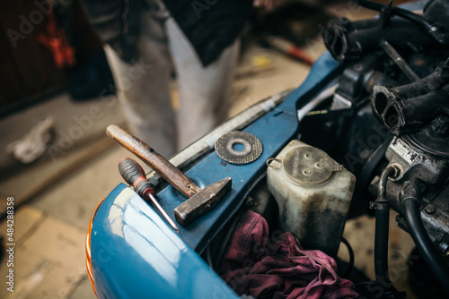 Old hammer and equipment on the car. photo