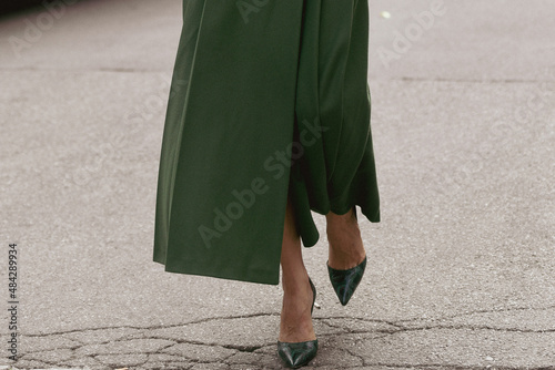 woman wearing green skirt and green shoes