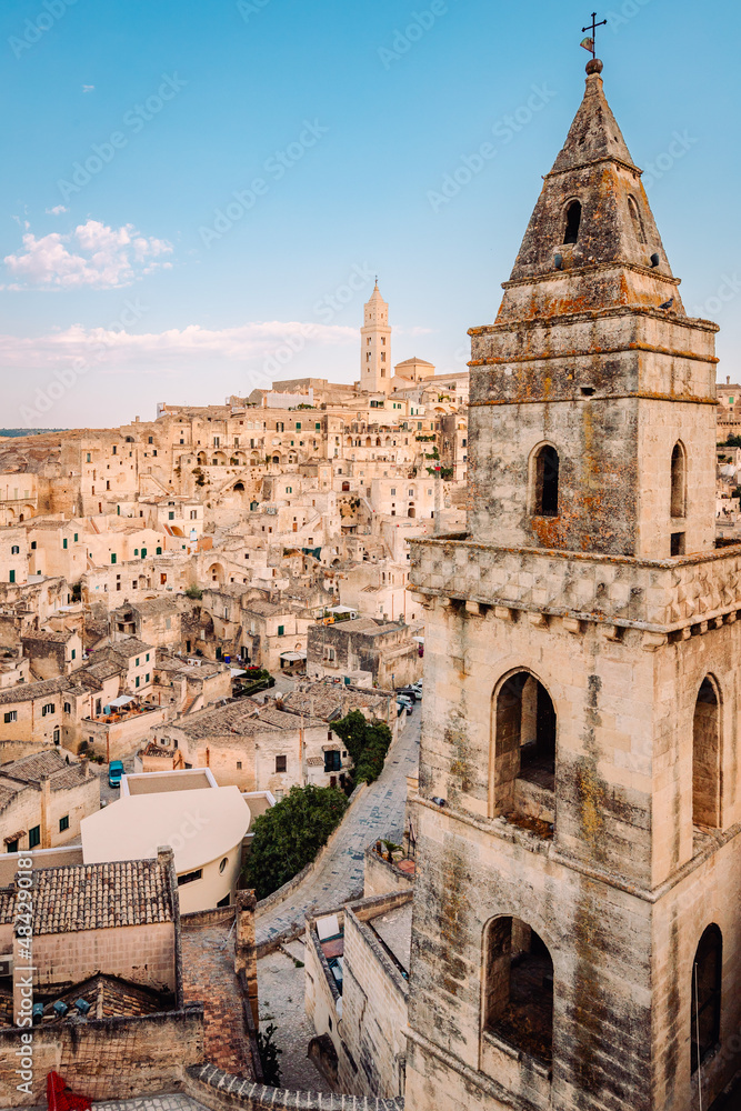 Fototapeta premium Sassi di Matera from the Belvedere di San Pietro Barisano, blue sky with clouds, vertical