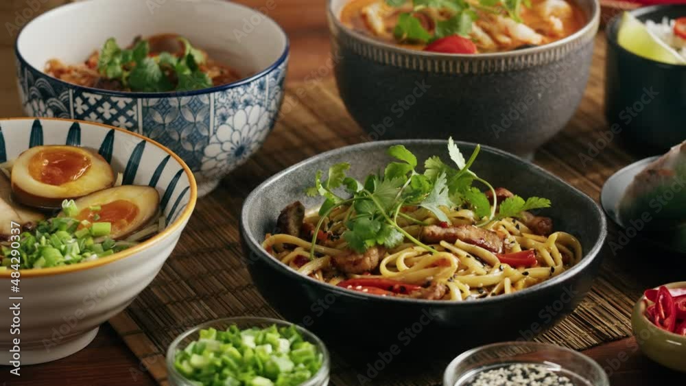 Japanese Ramen with Beef or chicken, rice noodles with fried meat, Tom Yam kung Spicy Thai asian soup, chef cooking in traditional korean chinese food. Close up of tasty vietnamese cuisine. 