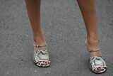 woman wearing snake leather shoes with open toe