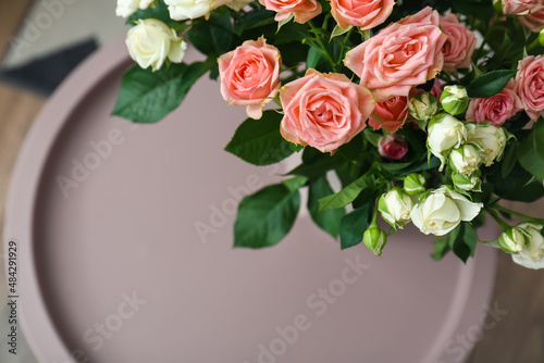 Fototapeta Naklejka Na Ścianę i Meble -  Bouquet of beautiful fresh roses on table in room, closeup