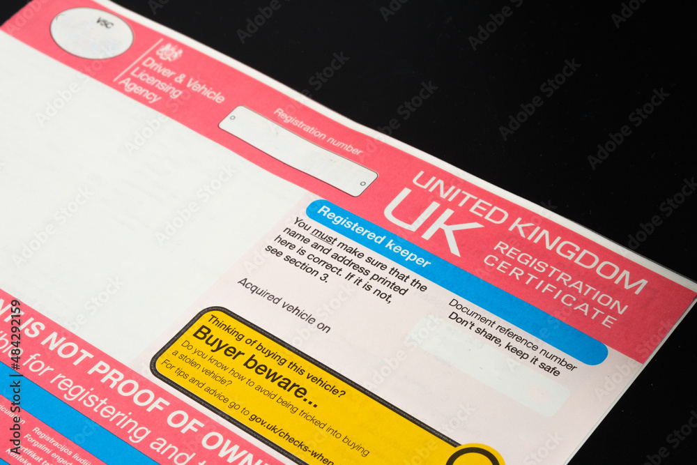 Genuine UK registration certificate for a purchased car seen on photo