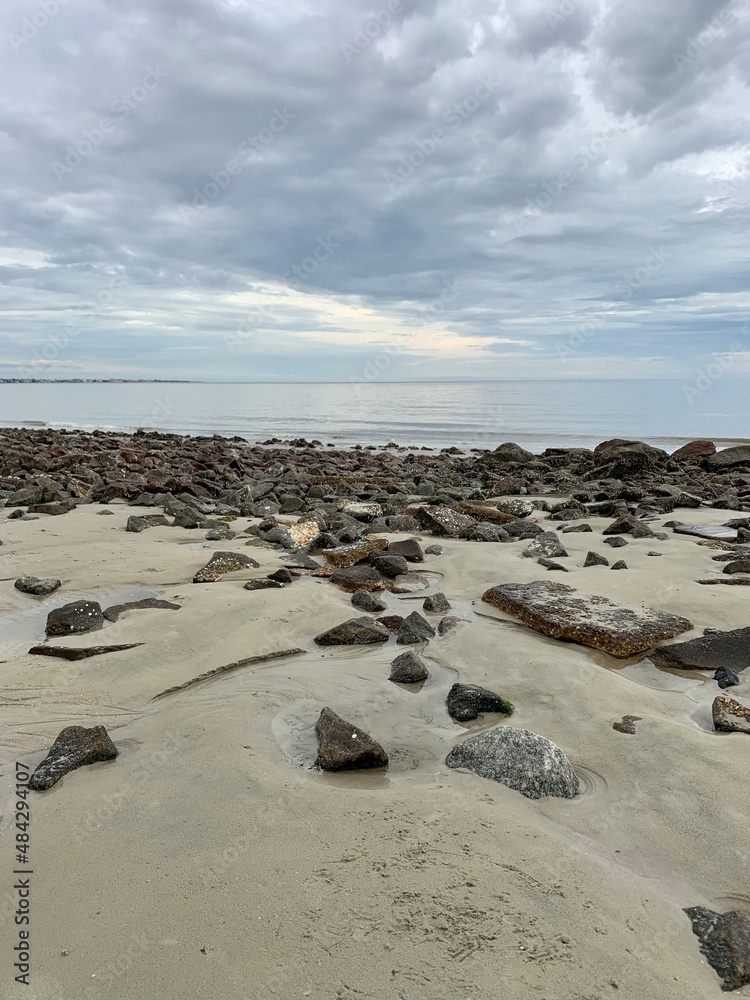 stones on the beach with sky
