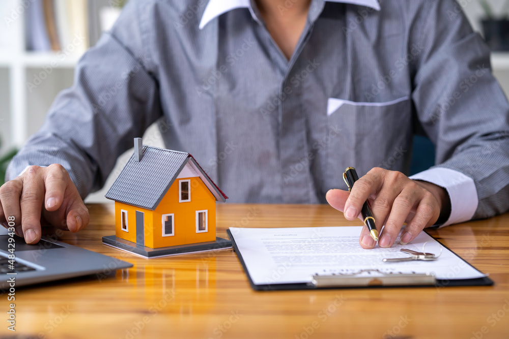 Real estate agents offer prices. and model homes, handing out keys