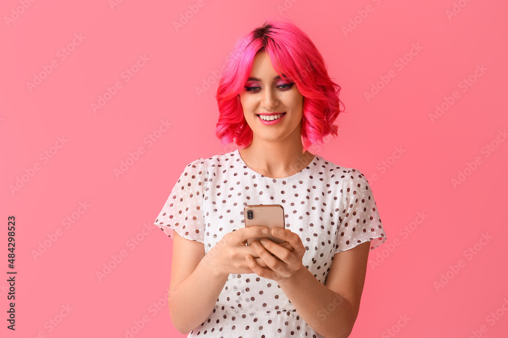 Stylish young woman with mobile phone on pink background Stylish young woman with mobile phone on pink background