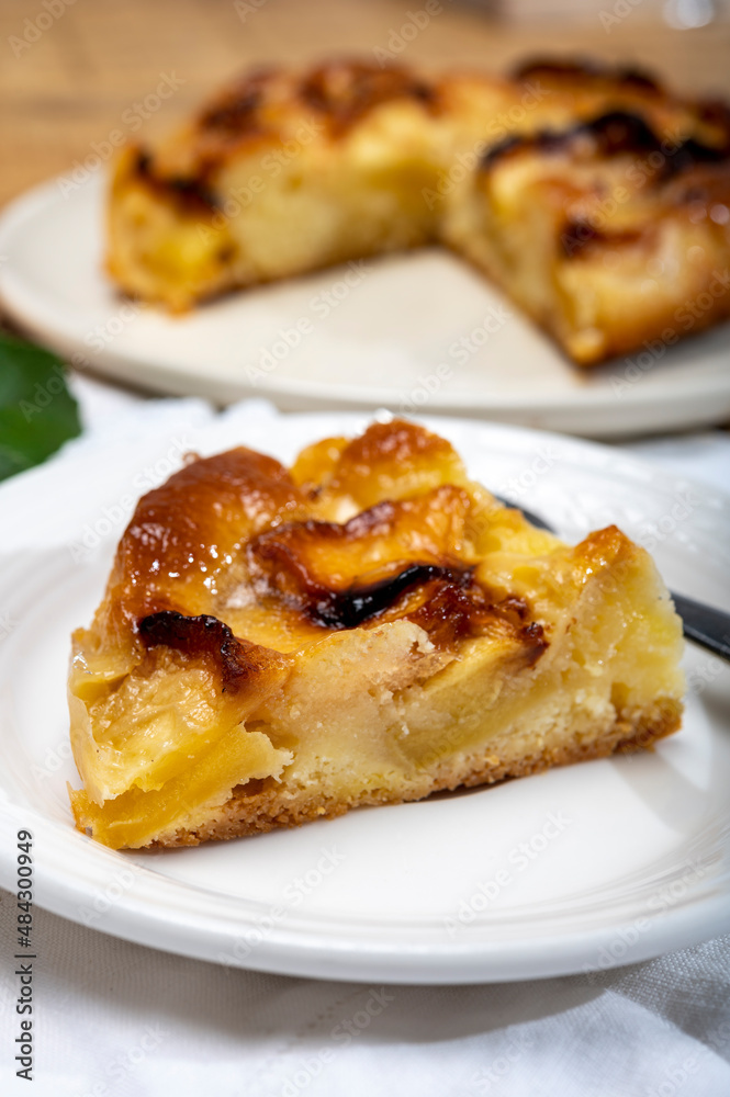 Baked apple cake with almond frangipani custard close up