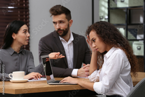 African American woman suffering from racial discrimination at work