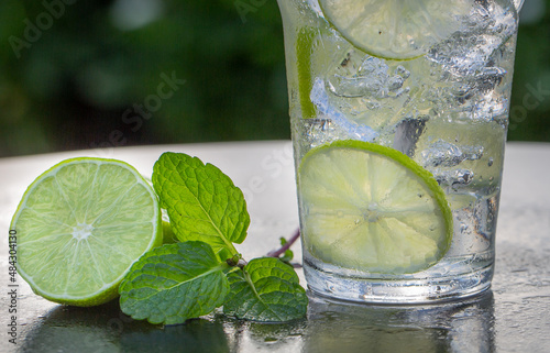 Water with Lime and Mint on Ice Close-up