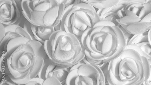 White decorative roses, rotation background. Close up
