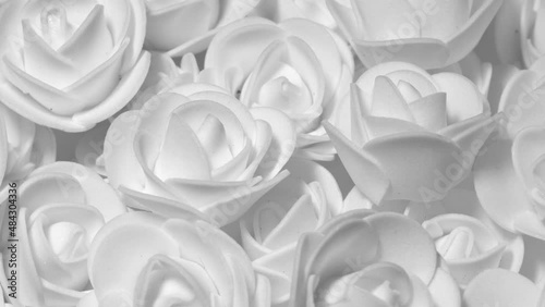 White decorative roses, rotation background. Close up