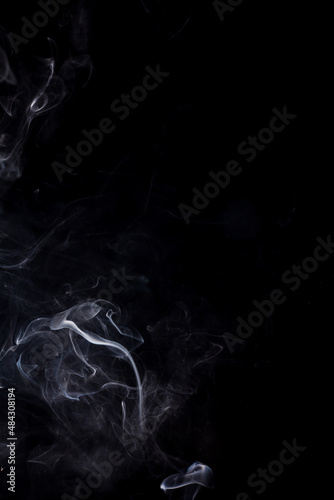 White smoke on black background.