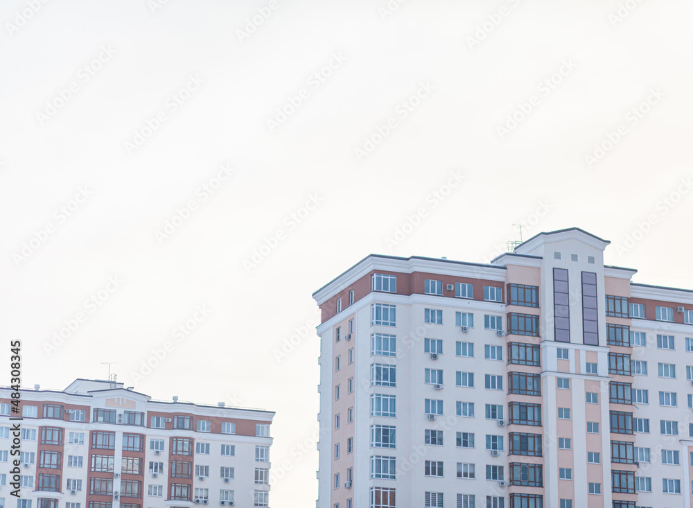 Multi-storey buildings against the sky. The concept of buying a new home or a new residential neighborhood. Buying a new home. Multi-storey buildings against the sky. The concept of buying a new home or a new residential neighborhood. Buying a new home.