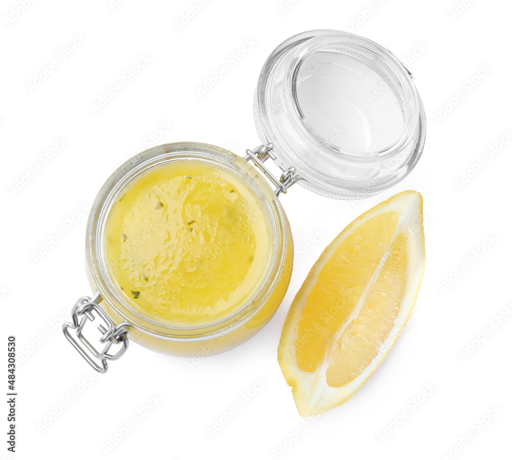Jar with lemon sauce on white background, top view. Delicious salad dressing Jar with lemon sauce on white background, top view. Delicious salad dressing