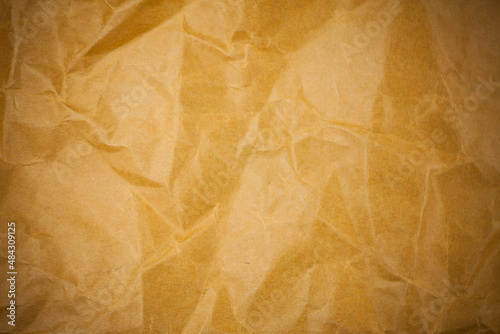 Old torn crumpled paper bag texture background.