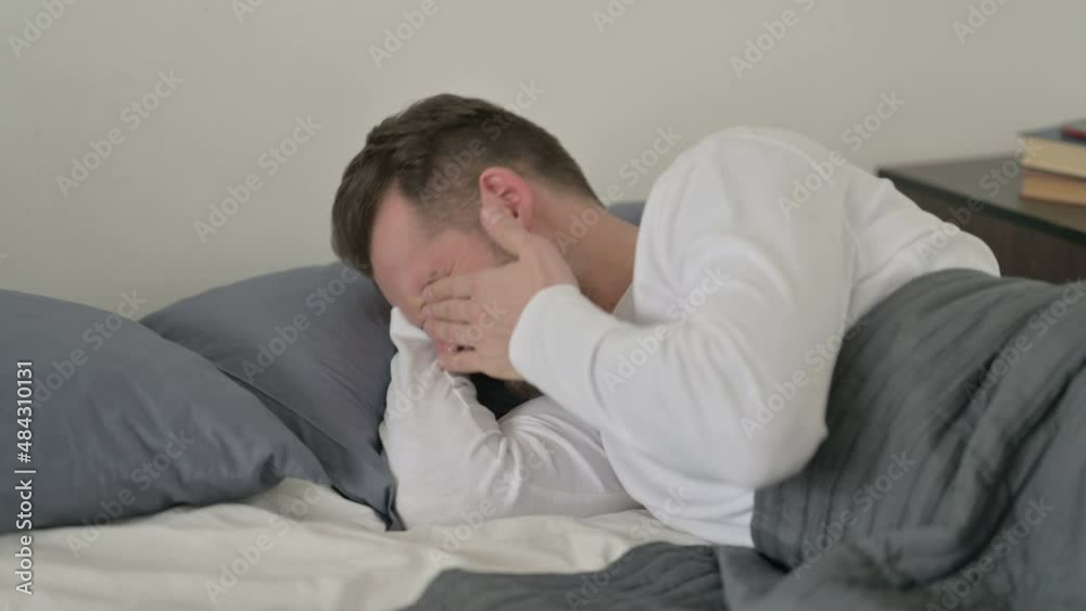 Man Crying while Sleeping in Bed Man Crying while Sleeping in Bed