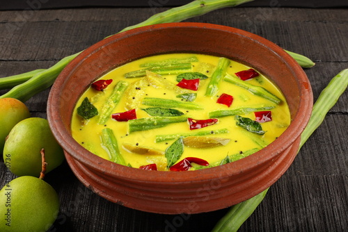 Moringa oleifera, green mango cuury dish. Asian , Sri lankan cooking. photo