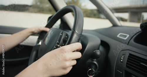 Female hands steering wheel woman drive car highway overtake close up