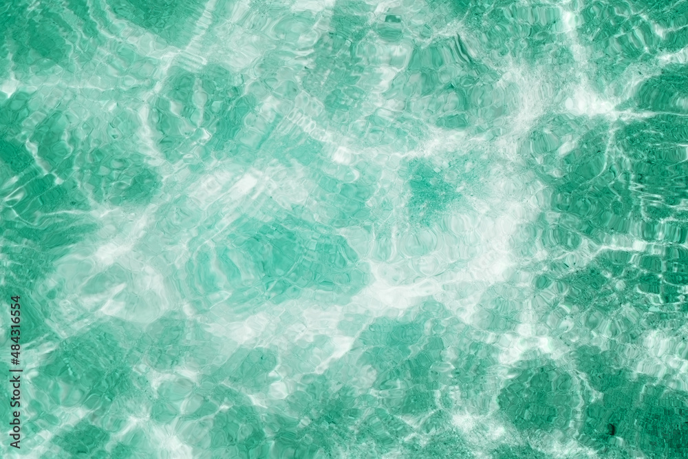 bright ripple surface of light blue swimming pool with sun reflect view from top see through floor ,abstract clean water glare detail for texture background or wallpaper bright ripple surface of light blue swimming pool with sun reflect view from top see through floor ,abstract clean water glare detail for texture background or wallpaper