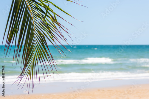 Fototapeta Naklejka Na Ścianę i Meble -  Beautiful tropical beach white sand turquoise ocean water and blue sky with clouds in sunny summer travel vacation day, landscape view