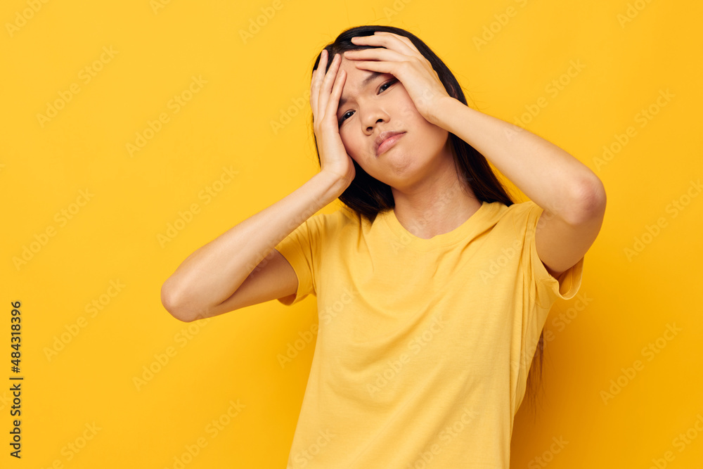 woman posing emotions problems studio yellow background unaltered woman posing emotions problems studio yellow background unaltered