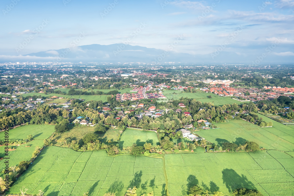 Land or landscape of green field in aerial view. Land on earth for agriculture farm, farmland or plantation with texture pattern of crop, rice, paddy in Chiang mai for sale, buy or investment.