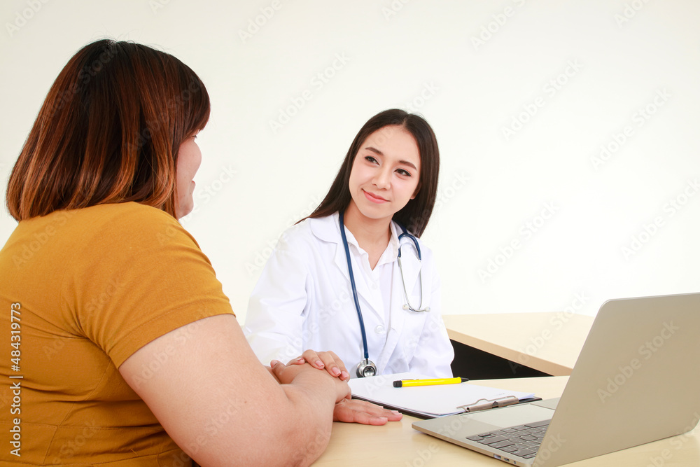 Female doctors perform treatment and examine symptoms of obese female patients. At risk of obesity and diabetes. Weight loss concept For good health Female doctors perform treatment and examine symptoms of obese female patients. At risk of obesity and diabetes. Weight loss concept For good health
