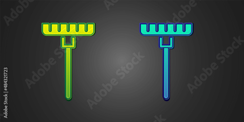 Green and blue Garden rake icon isolated on black background. Tool for horticulture, agriculture, farming. Ground cultivator. Housekeeping equipment. Vector
