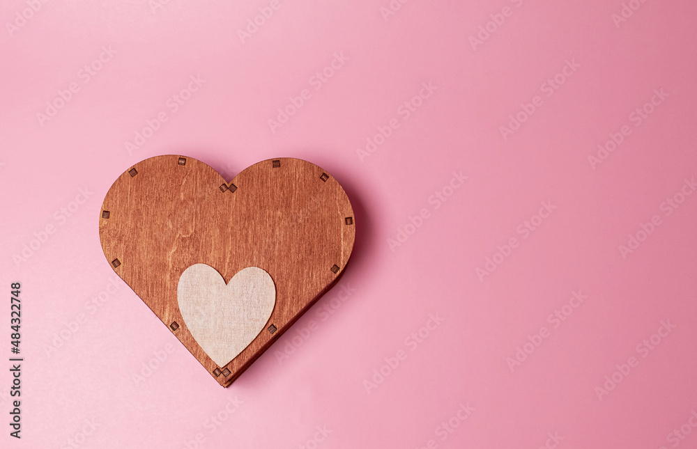 A large wooden heart and a small wooden heart