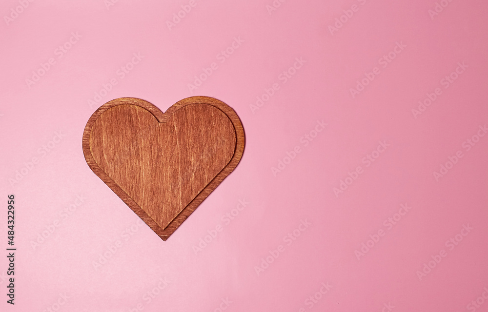 A large wooden heart of dark brown color