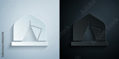 Paper cut Tourist tent icon isolated on grey and black background. Camping symbol. Paper art style. Vector