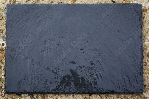 Wet Dark Stone on Textured Countertop