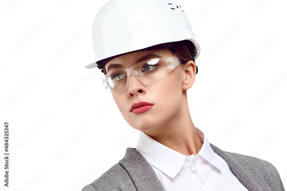 Portrait of a young woman engineer protective time wearing glasses on a white isolated background Portrait of a young woman engineer protective time wearing glasses on a white isolated background