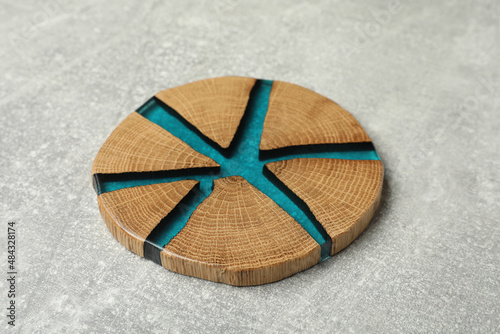 Stylish wooden cup coaster on light grey table
