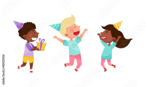 Happy kids celebrating birthday set. Joyful children in party hats having fun at party cartoon vector illustration