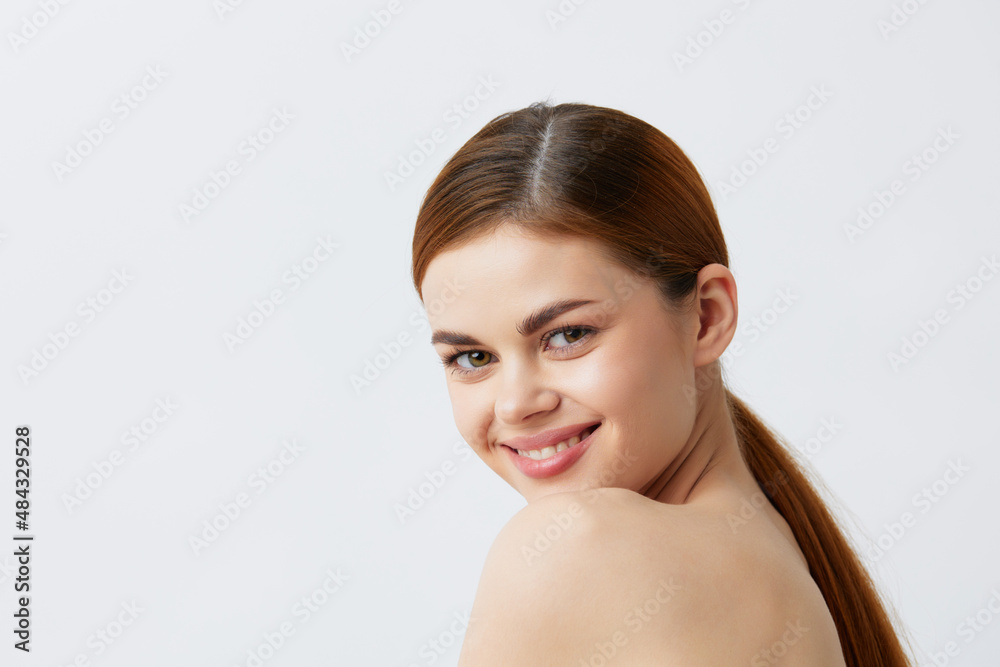 beautiful woman red hair bare shoulders cosmetics skincare light background beautiful woman red hair bare shoulders cosmetics skincare light background