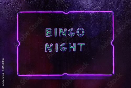 Neon Bingo Night Sign in Rainy Window