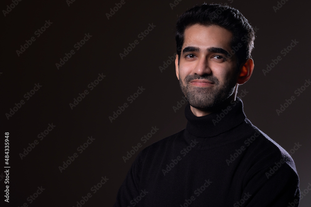 Portrait of a handsome young man looking at the camera Portrait of a handsome young man looking at the camera