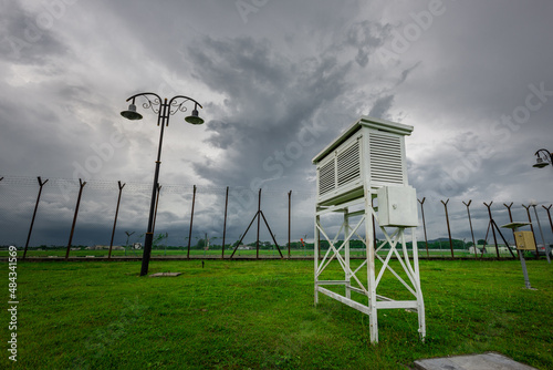 Cloudy cloud over stevenson screen on meteorology farm in Butterworth, Penang Malaysia Station photo